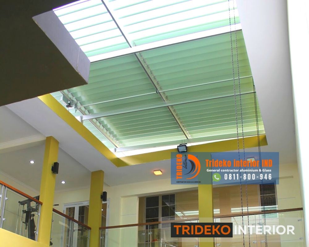 Kanopi Buka Tutup Lovera 3 a glass roof with a light above it